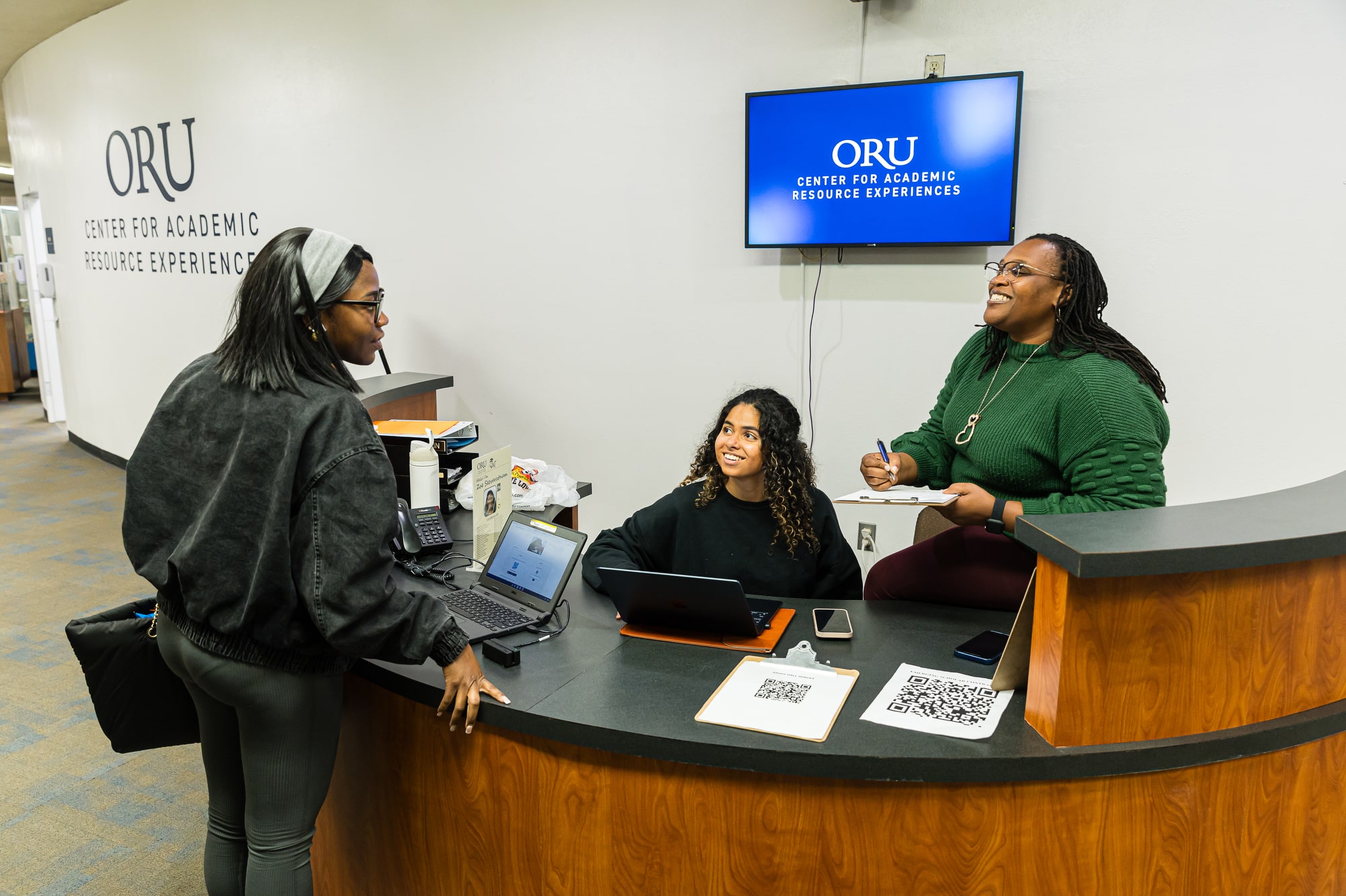 Student approaching the welcome desk