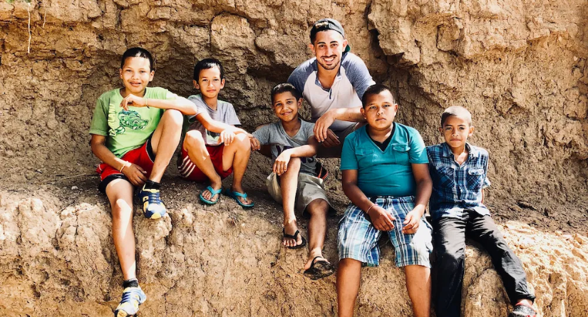 Michael Weitman on mission trip in Ecuador with children