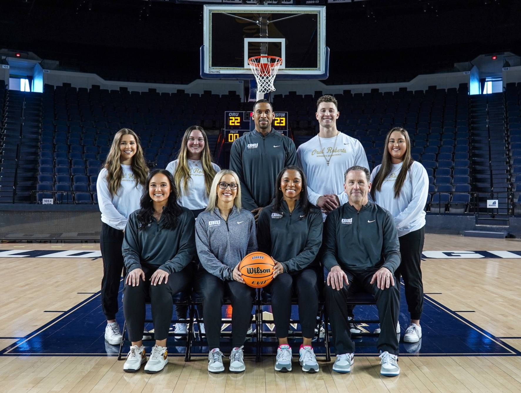 Group photo of Tori and women's basketball leadership