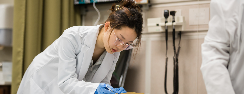 Healthcare professional providing patient care in a clinical setting.