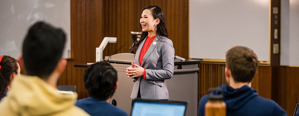 Business professional presenting organizational leadership strategies to an audience at ORU.
