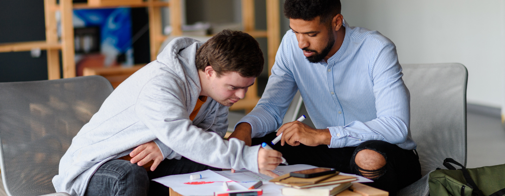 Educator providing individualized learning support to a student.